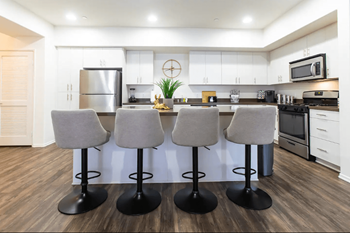 Spacious kitchen islands with cabinets (per plan) and quartz countertop
